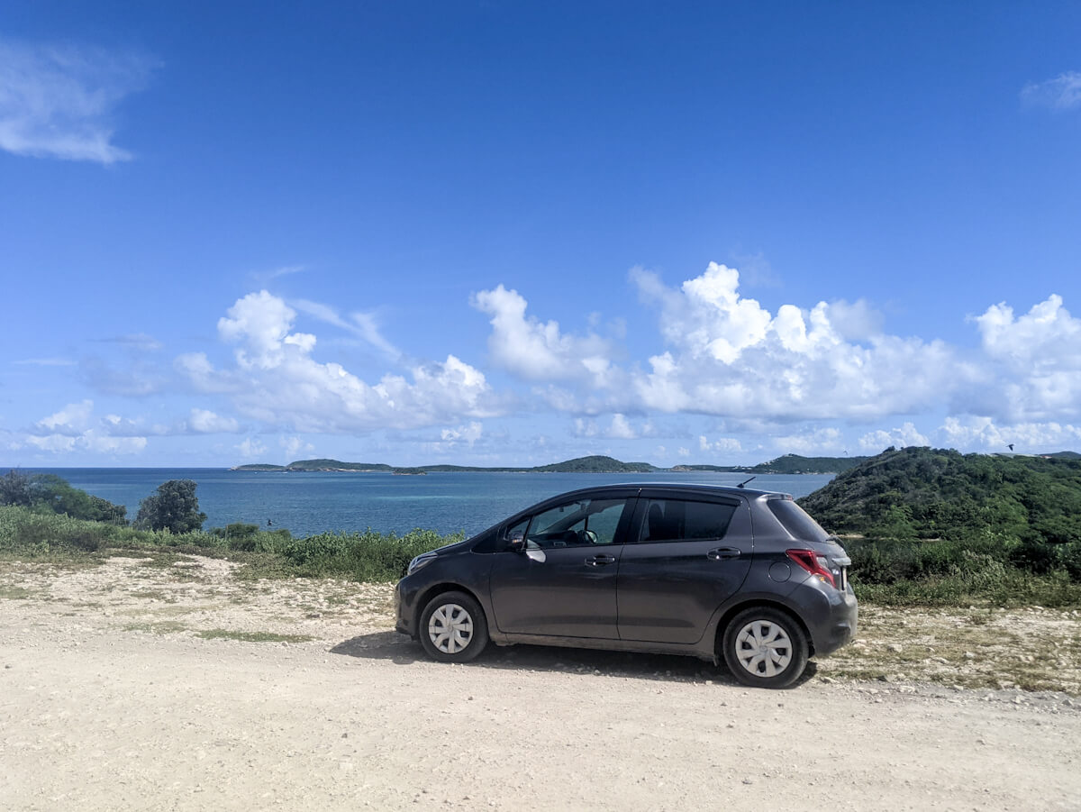 a car paused at a lookout in antigua